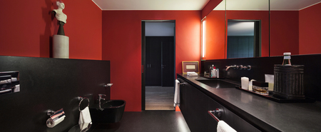 comfortable bathroom in modern design, red wallsの写真素材