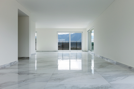 Interior of empty apartment, wide room with marble floorの写真素材