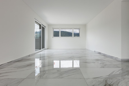 Interior of empty apartment, wide room with marble floorの写真素材