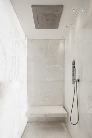Shower covered in white marbleの写真素材