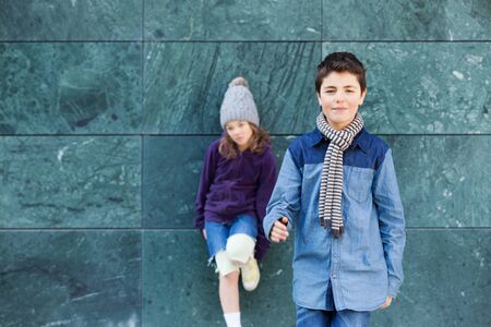 portrait of two fashionable kids, outdoorsの写真素材