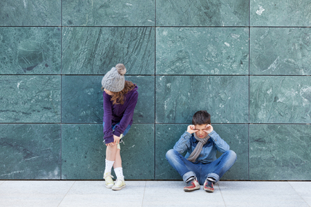 portrait of two bored kids, outdoorsの写真素材