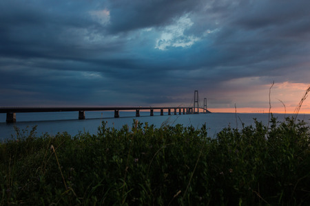 Storebæltsbroen bridge. The sun is settingの写真素材