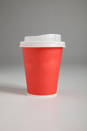 Paper cups on gray background, coloredの写真素材