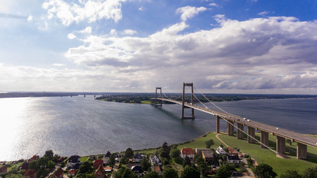 New Little Belt Bridge and small town of Middelfart seen from aerial viewの写真素材