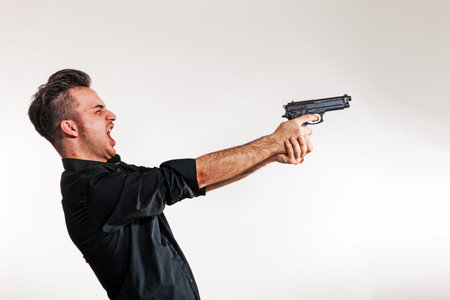 Boy targets the gun, he's about to shoot