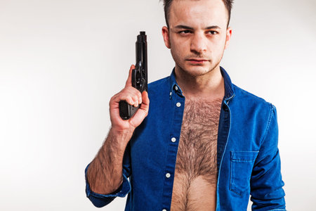Boy with gun on white background