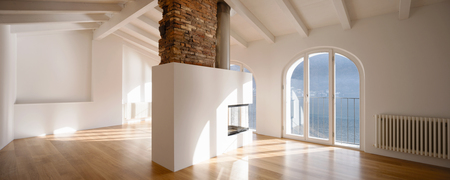Modern renovated apartment with a large fireplace in the middle of the room which makes the ambieme more comfortingの写真素材