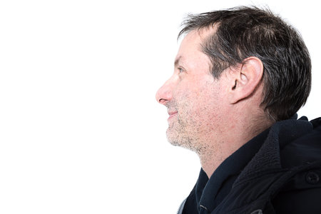 portrait of middle-aged man in studio on white backgroundの写真素材