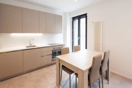 Modern minimalist kitchen with large tiles. Nobody insideの写真素材