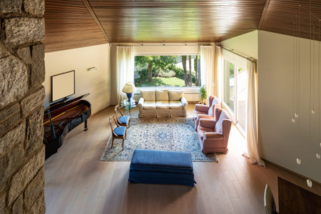 Modern living room with wooden ceiling in the villa. Nobody inside