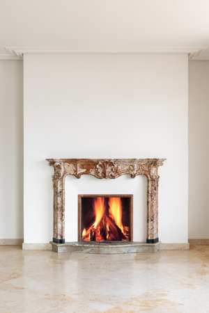 Fireplace detail with lit fire. conceptの写真素材