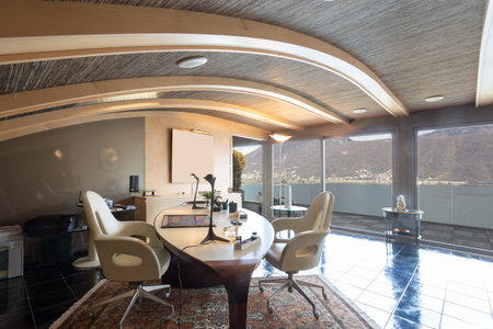 Modern studio with white leather chairs. No one insideの写真素材