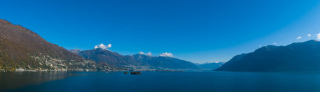 Landscape of Maggiore lake in autumn day. Backlight and water