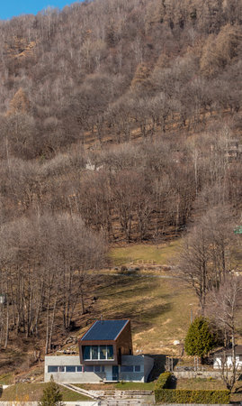 Exterior modern isolated villa, surrounded by nature. Iron and concrete cladding. Nobody inside