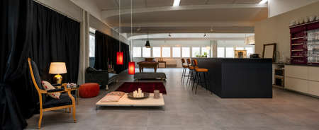 Detail of the room with a pool table, a sitting area with armchairs and sofas and a bar corner. Nobody insideの写真素材