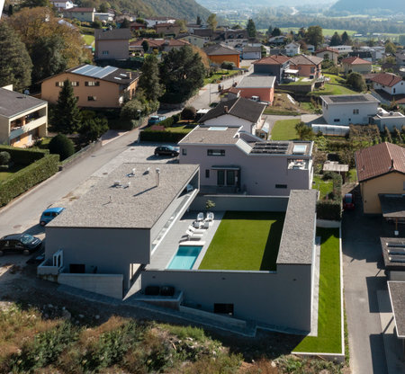 Exterior modern villa with swimming pool. The house is surrounded by mountains. Nobody insideの写真素材