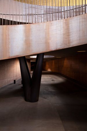 Detail of large modern design iron staircase. Great contrast of light and shadow. No one inside.の写真素材