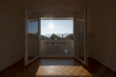 Interior of an empty room, front view with a window at the back. Large spaceの写真素材