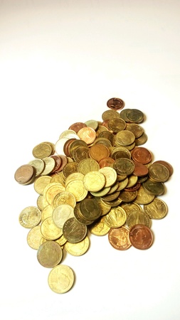 Many coins are on the white floor.の素材