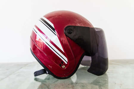 red helmet on mortorbike a home .の写真素材