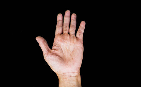 women right hand open palm on black backgroundの写真素材