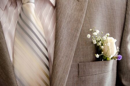Flower boutonniere of roses in the costume pocketの写真素材