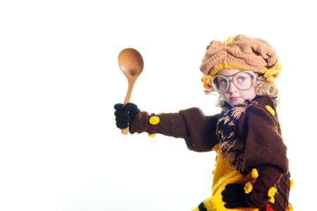 The girl in a suit and the big spoon in handsの写真素材