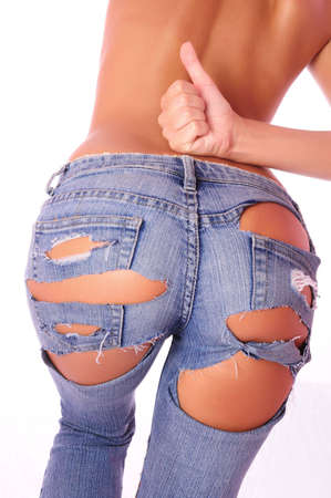 , harmonous woman in jeans, with a naked backの写真素材