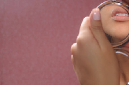 Beautiful lips are reflected in a mirrorの写真素材