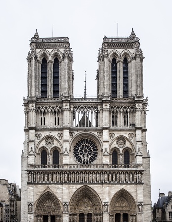 Notre Dame de Paris with white sky  Notre-Dame de Paris or Our Lady of Paris is a historic Roman Rite Catholic Marian cathedral on the eastern half of the Île de la Cité in the fourth arrondissement of Paris, Franceの写真素材