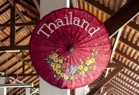 Beautiful umbrella with the wording of Thailand name  Thailand is a country in Southeast Asia  With great food, a tropical climate, fascinating culture and great beaches, Thailand is a magnet for travellers the world over の写真素材