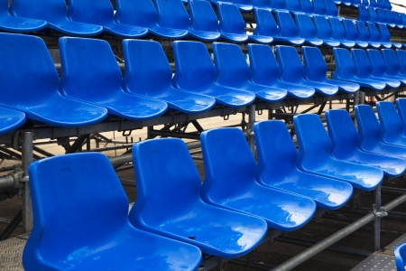 Empty plastic seats at stadium, open door sports arena の写真素材
