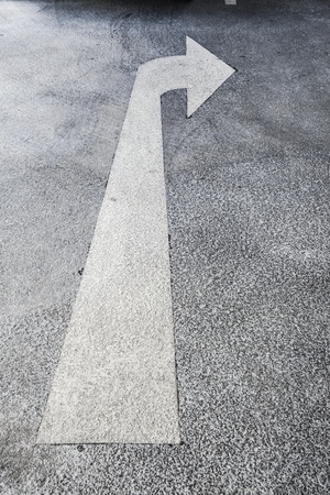 Turn right traffic sign on the road  Direction sign- right turn warning on the road background with blank for textの写真素材
