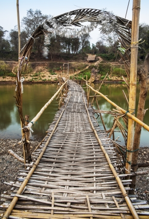 Bamboo Bridge across Mekong riverの写真素材