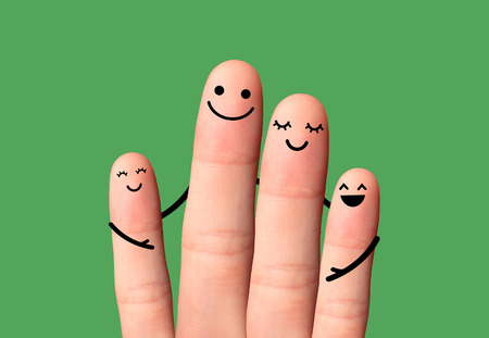 Happy family hug on green background  Happy fingers, Two small child, father and mother の写真素材