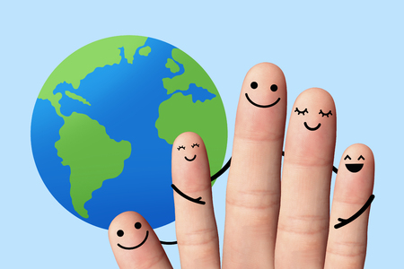 Happy family with the earth, travel, environmental protection concept  5 fingers with the earth on blue background の写真素材