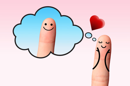 A happy couple in love, valentine concept  - Happy finger, Girl in love blushing with hands in cheeks thinking on the boy of her dreams の写真素材