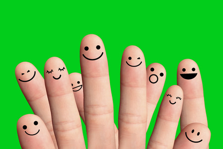Happy people on green background - friendship concept の写真素材