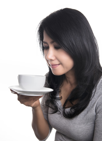 Beautiful Girl Drinking Tea or Coffee  - Cup of Hot Beverage, chocolate, cacao, tea or coffee の写真素材