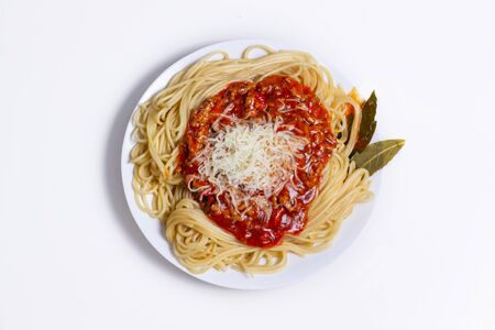 Delicious Spaguetti Pasta with bolognesa tomato sauce and chopped meat. Adorned with cheese and Laurel leafの写真素材
