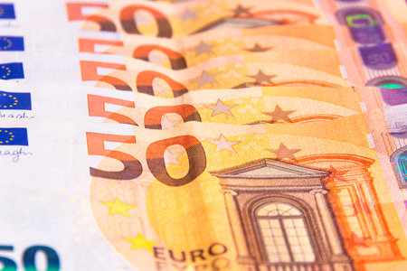 stacked up 50 euros Bills with coins