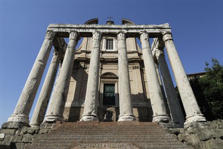 Church of San Lorenzo in Miranda and The Temple of Antoninus and Faustina in the Roman Forum Rome Italyの写真素材