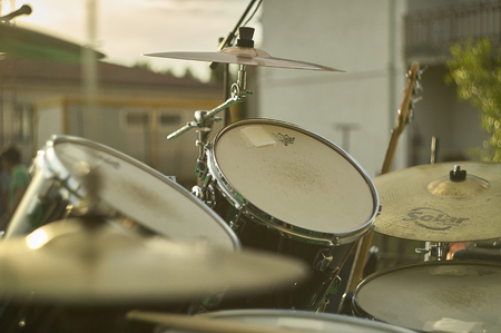 View of a drums, musical instrument, from the point of view of the player, shot in a stage ready for a live concert of a rock band.のeditorial素材