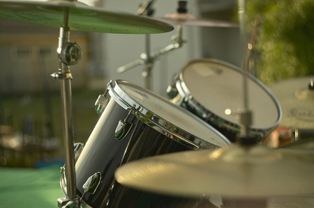 View of a drums, musical instrument, from the point of view of the player, shot in a stage ready for a live concert of a rock band.の写真素材