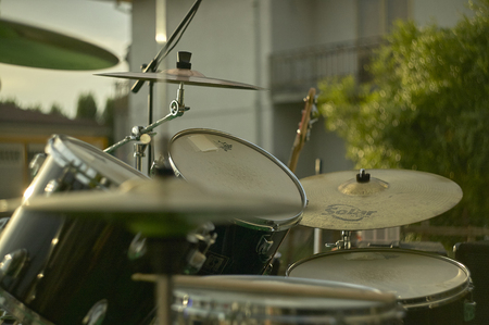 View of a drums, musical instrument, from the point of view of the player, shot in a stage ready for a live concert of a rock band.のeditorial素材