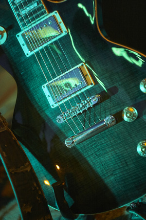 Detail of the ropes of an electric guitar in a concert of a rock bandの写真素材