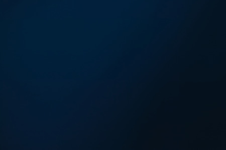 Colored background with a shade of color ranging from blue to black. Ideal for graphic designs and to be used as background.の写真素材