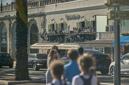 Scene of daily life, the aperitif, on the promenade of Nice, city of the French shoreline coast taken during sunset.のeditorial素材