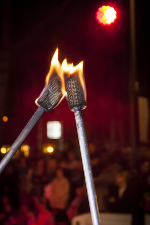 Torches burned with flames used by jugglers in a showの写真素材